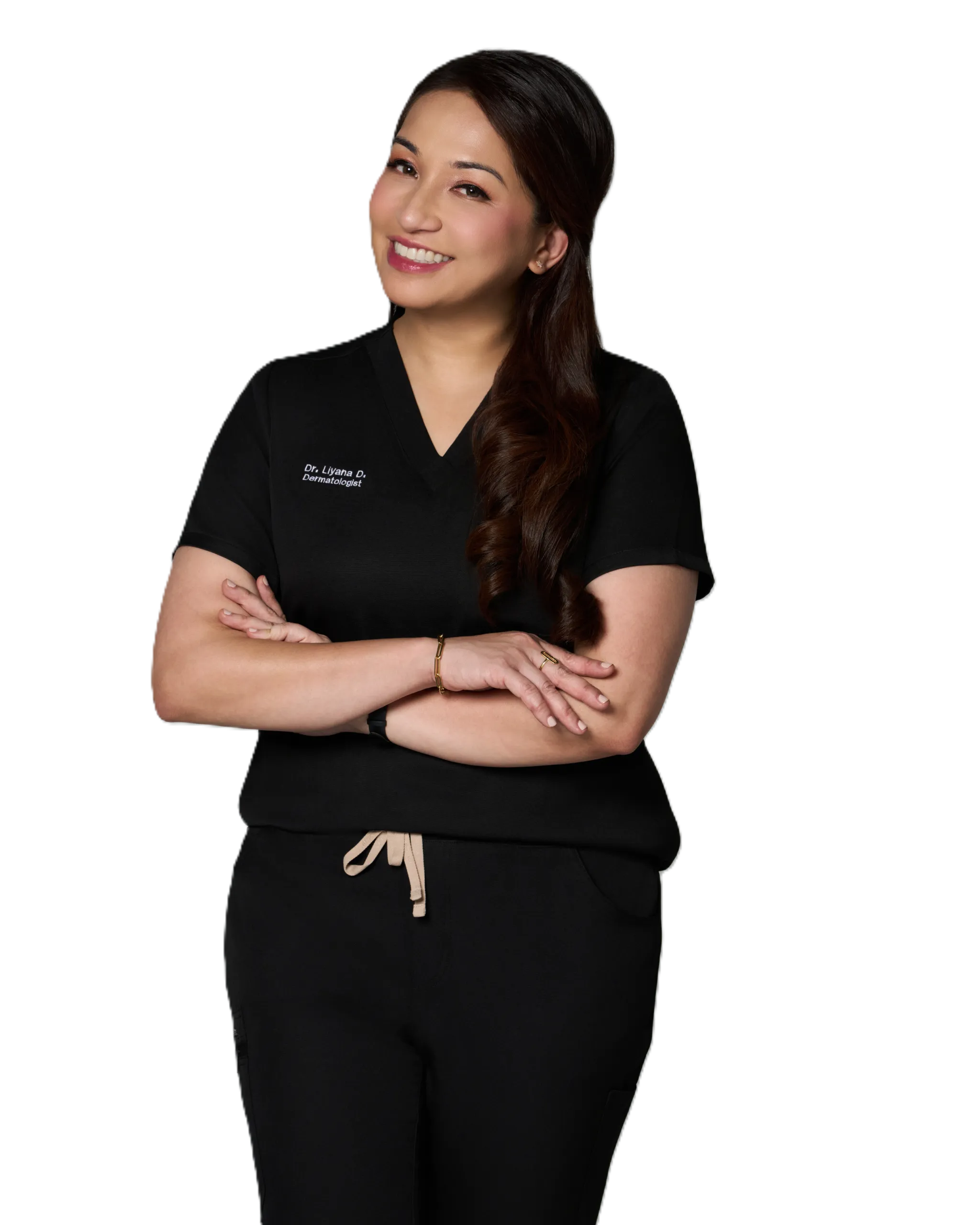 A professional skincare specialist smiling and wearing a black uniform.
