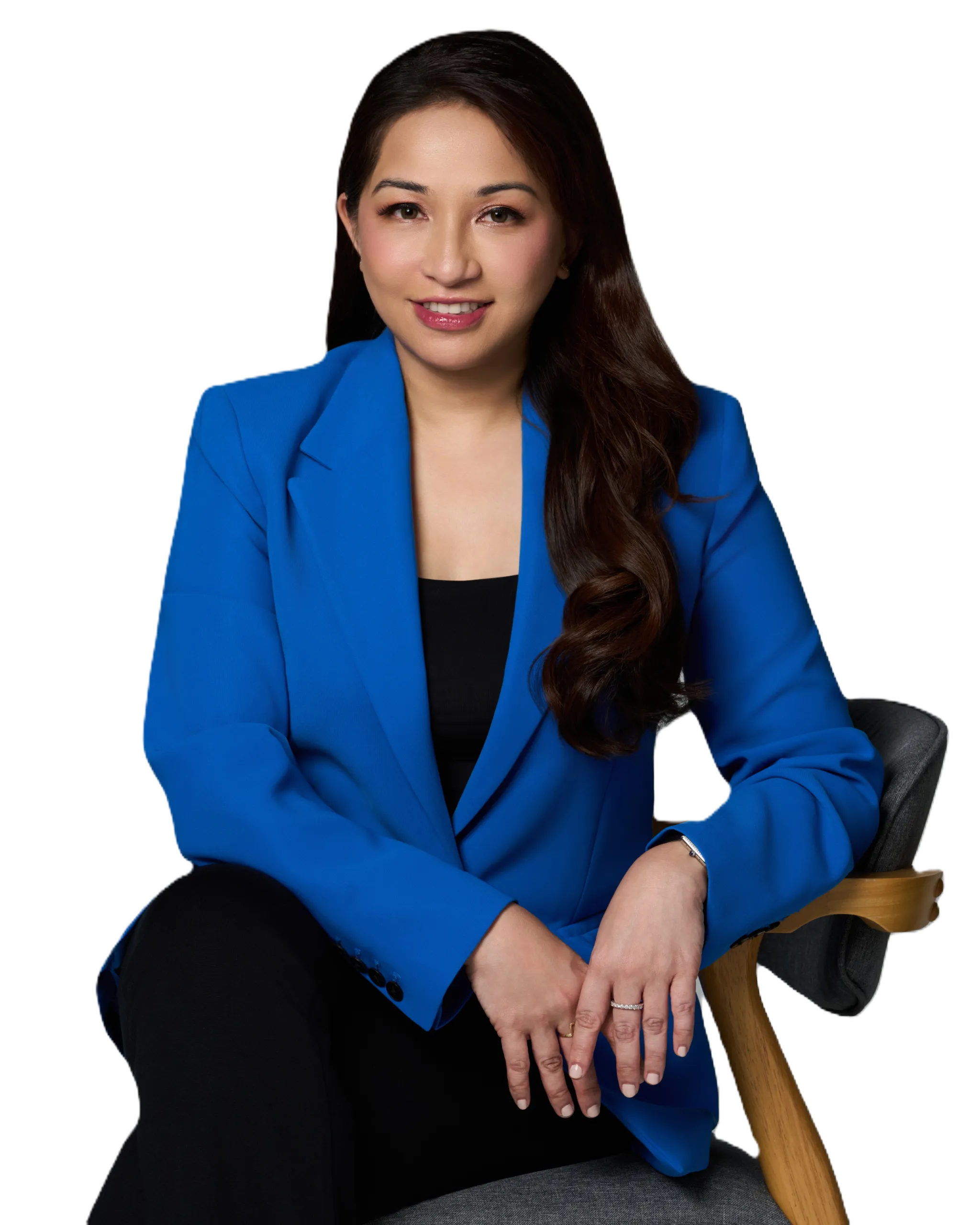A skincare specialist smiling in a professional setting.
